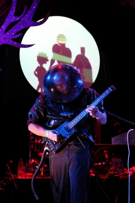 kazaamBLAM! playing a guitar at Splore music festival, 2010